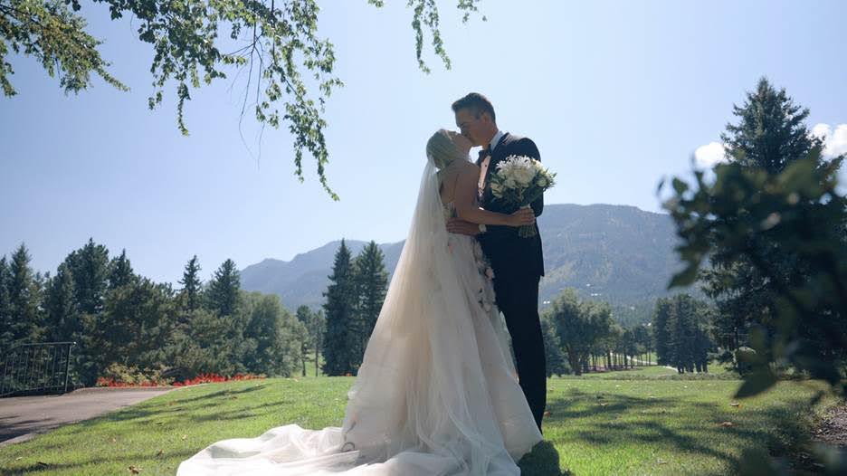 Allison and Cannon sharing a kiss on their wedding day at The Broadmoor in Colorado Springs, Colorado