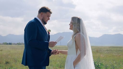 Ramiro Portillo reading vows to Abbie Schek during the ceremony at 957 Main Street in Louisville, Colorado