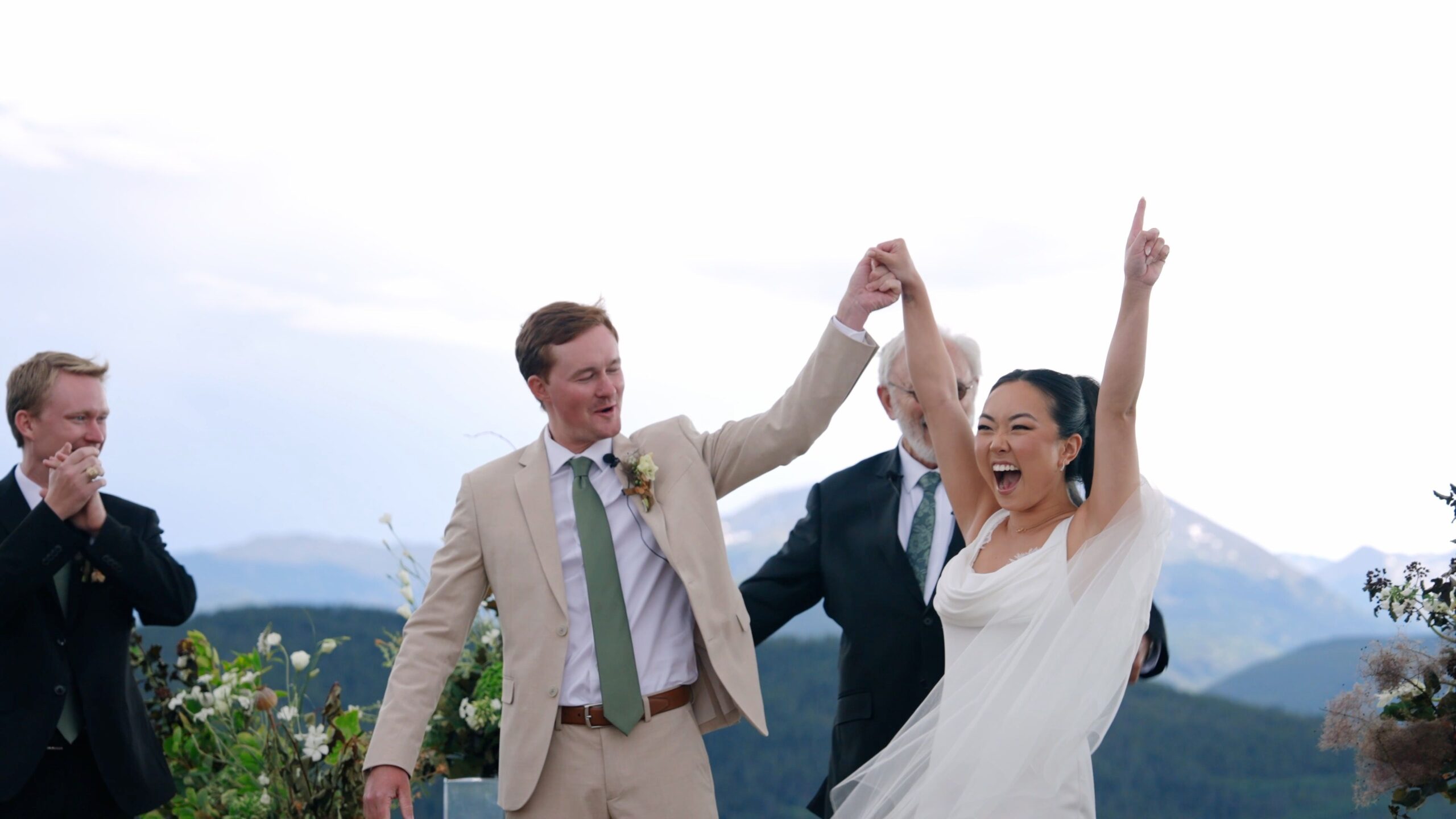 Newlyweds celebrating a mountain top wedding in Colorado, captured by Ampersand Family documentary videography.