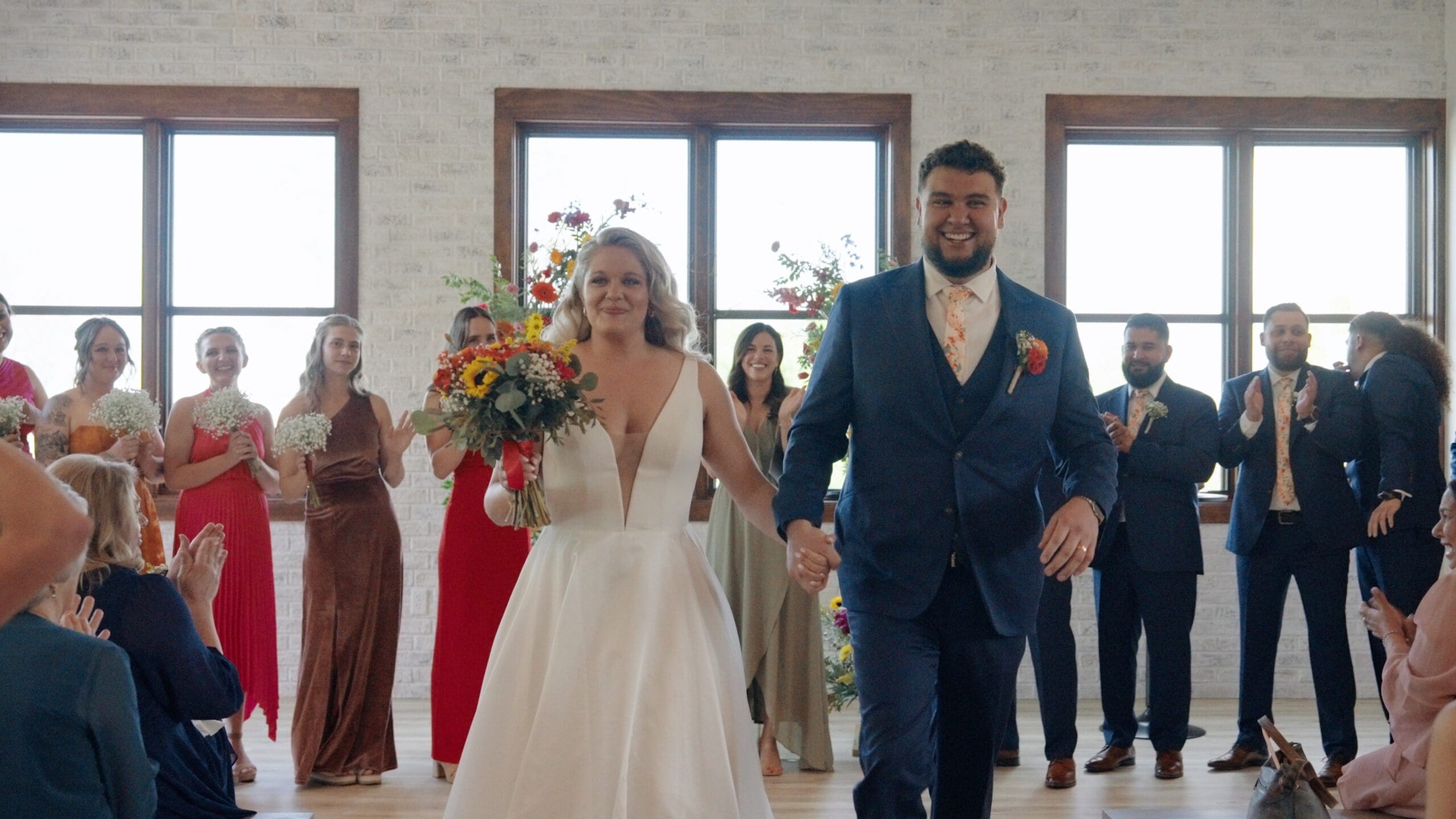 Emotional candid wedding moment captured by a Colorado wedding videographer during a real wedding day