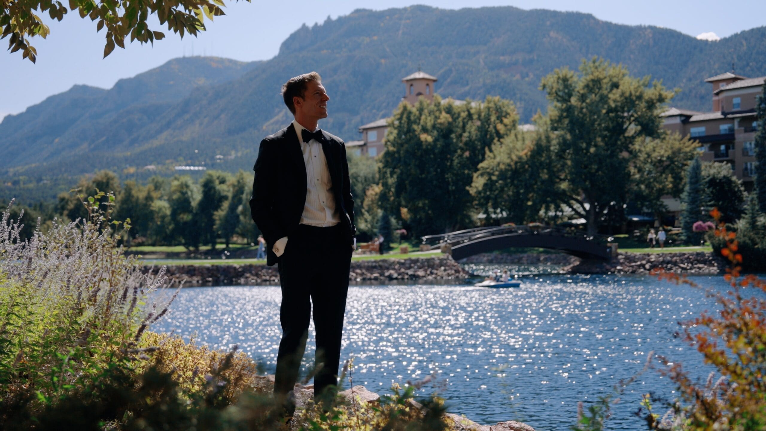Cinematic mountain wedding venue in Colorado during golden hour with bride and groom outdoors