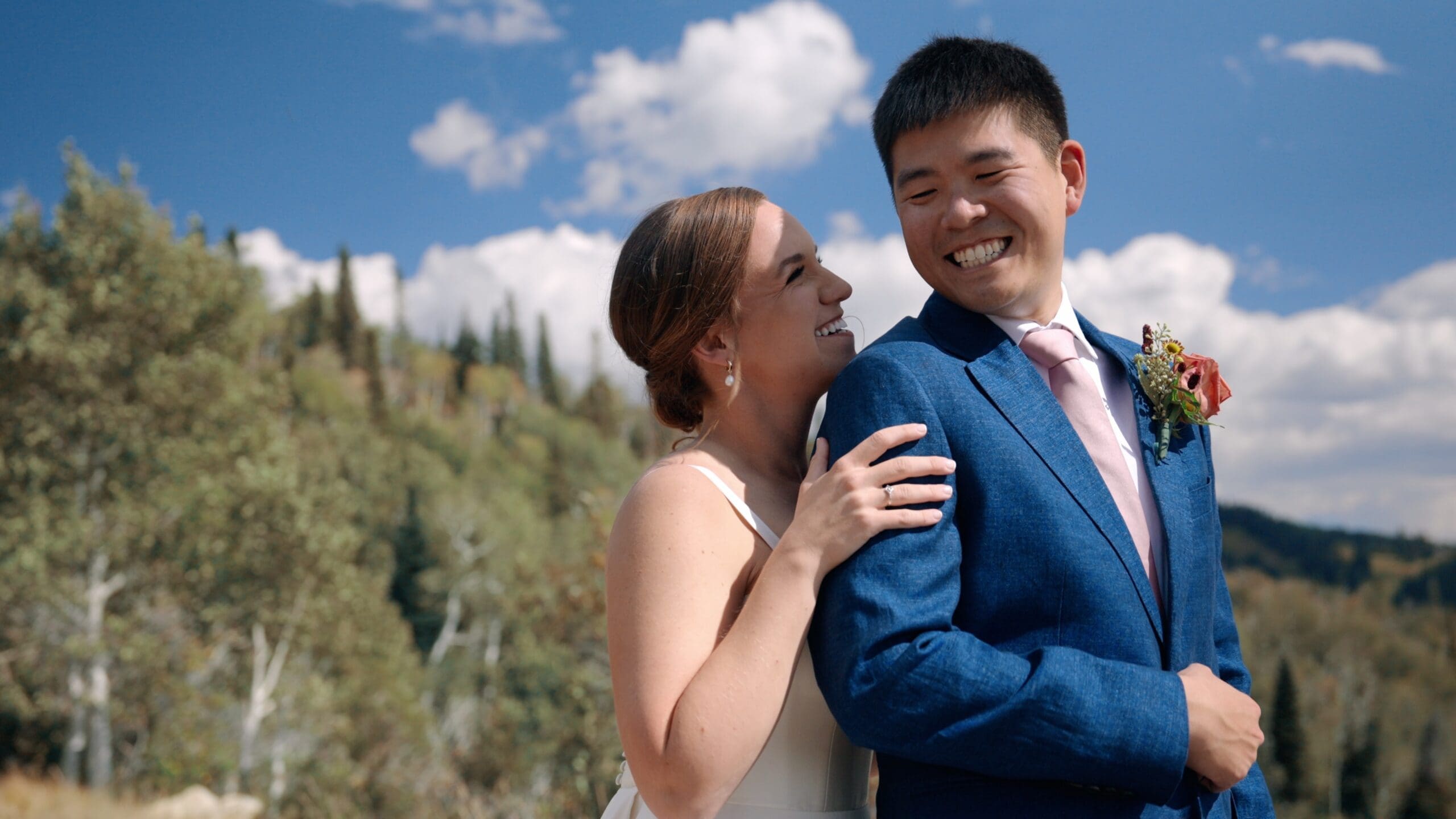 Wedding videographer filming authentic emotional moments during a Colorado mountain wedding